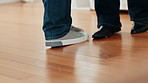 Feet, couple and dancing with love at house for movement, listening to music and bonding together. Shoes, people and moving with rhythm, romantic song and partner support for marriage commitment