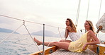 Travel, relax and friends on yacht in ocean for vacation, tropical adventure and tourist destination. Happy, sailing and women on boat for cruise, journey and explore islands on summer holiday