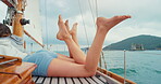 Travel, relax and peace with legs on yacht for cruise, summer vacation and transportation. Tropical getaway, sailing and adventure with people on boat outdoor for seaside trip, voyage and holiday