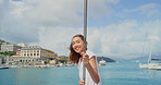 Happy woman, vacation and ocean trip with boat for tourism, sightseeing adventure or travel. Portrait, female person or smile with ship or water for island city, holiday or outdoor getaway on sea