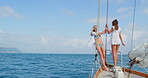 Travel, freedom and summer with friends on yacht for sailing, seaside adventure and weekend getaway. Vacation, excited and tropical journey with women on boat outdoor for luxury holiday and space