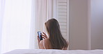 Phone, scroll and woman in bedroom, back or check notification for online dating message. Home, relax or person by bed with mobile for social media app, connection and search profile for matches