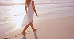 Travel, walking or woman at beach with sunset, tourist trip or peace on seaside vacation. Space, waves or female person outdoors with ocean getaway, calm stroll or summer evening on holiday break. 