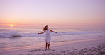 Travel, sunset or woman at seaside with dancing, carefree or peaceful perspective on ocean vacation. Space, beach waves or tourist with movement, calm mindset or summer evening on holiday break.