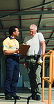 Clipboard, logistics and meeting with men outdoor together for delivery or shipping management. Conversation, paperwork and teamwork with supply chain people at distribution plant for planning