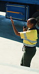Black woman, talk and logistics with radio outdoor for storage, loading truck and dispatch control. Person, hand gesture and guidance for cargo coordination, delivery management and safety compliance