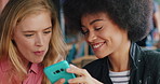 Friends, women and phone at restaurant, social media and share funny post while eating pizza. Mobile, people and bonding together at diner, show meme and fast food website for lunch on weekend