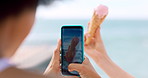 Ice cream, picture and hands with phone screen at beach, influencer and image for social media post. Ocean, content creation and people with mobile for dessert promotion, photo and digital marketing
