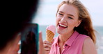 Influencer, phone screen and friends at ocean with ice cream, laugh or digital memory on summer vacation. Happiness, windy or people with cone, social media update or content creation on seaside trip
