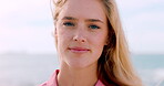 Travel, face or woman at beach with smile, ocean trip and fresh air on summer break. Windy, wellness or female person at seaside with portrait, tourist vacation or outdoor getaway in Australia.