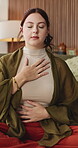 Mindfulness, calm woman or breathing in home, relaxation routine or body awareness practice for wellness. Meditation, inner peace or person in lounge for breathwork exercise, zen or mental health