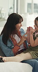Mother, child and play in home, relax and pointing together with hug from funny parent. Mom, girl and laugh in living room for connection, talking and clapping for bonding with embrace for love