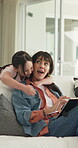 Hug, tablet and surprise with mother and daughter on sofa in home for streaming, love and bonding. Movie subscription, hello and media search with woman and child in living room of family house