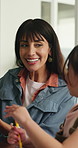 Mother, child and talk in house with homework, academic task and teaching lesson for skill development. Woman, daughter and discussion in home with assessment, help or learning support for education.