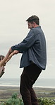 Happiness, father or daughter outdoor with spinning, healthy relationship or bonding in childcare. Playful, man or child with swinging, holding hands or parent connection in childhood development.