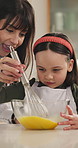 Baking, mom or daughter in house with whisking, bonding or support in learning to cook. Help, woman or child with food preparation, healthy relationship or family connection for cognitive development