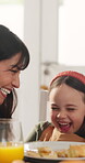 Laugh, mother and daughter in home with breakfast, bonding or childcare in healthy relationship. Playful, woman or child with nose kiss, morning meal or family connection for childhood development.