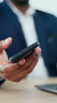 Hands, phone and laptop with typing at office with contact, notification and project at insurance company. Person, broker and smartphone with computer, mobile app or texting at risk management agency