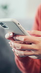 Typing, phone and hands of woman in home with texting, communication or networking on mobile app. Chat, technology and female person with cellphone for contact on website in living room at apartment.