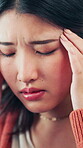 Stress, pain and woman with headache in home with discomfort, temple pressure and mental fatigue. Tired, asian girl and migraine in house with burnout, brain fog and overwhelmed by uncomfortable ache
