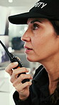 Security, woman and talking with radio in control room, working late or discussion for surveillance. Watch, video and mature person with tech for protection service, flare and communication at night