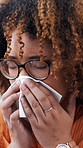 Sick, woman and sneeze with tissue in home from sinus, nasal congestion and flu symptoms. Person, napkin and blowing nose with viral infection, contagious illness and allergies from influenza disease