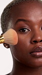 Face, beauty and black woman with makeup brush in studio, facial makeover routine and apply blush. Portrait, cosmetics tools and person with pigment for natural glow, aesthetic and white background 