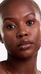 Face, skincare and black woman in studio with beauty, vision and contemplation for antiaging benefits. Confident, person and dermatology for glowing skin, self care and thinking on white background.