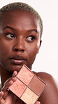 Black woman, makeup and powder in studio for beauty with thinking, foundation or choice on white background. African person, cosmetics and product for face, perspective and reflection with glow