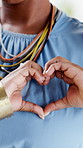 Woman, heart hands and gesture for love, positive emotion and care with kindness in home. Good news, female person and happy for emoji, symbol or sign for support, affection or romance in house