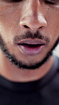 Fitness, tired or mouth outdoor with breathing, cardio challenge or break in intense practice. Rest, exhausted and man with exercise, training fatigue and workout recovery for performance goals.