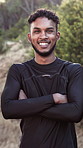 Face, runner and man in nature with arms crossed, training goals and positive attitude for exercise. Happy, active person and athlete outdoor with confidence, wellness or prepared for sports workout.