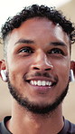 Thinking, nature and happy man with earphones for fitness, training and exercise for wellness. Sports, runner and person with smile listening to audio, podcast and music for active hobby outdoor