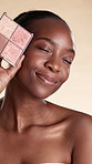 Cosmetics, face or black woman with highlighter, sparkling color or glam product on studio background. Beauty, portrait or person with glow treatment, bright palette or shine pigmentation in makeup.