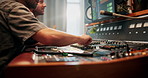 Production, music and hands of producers with headphones in studio working on album or song with computer. DJ, equipment and male sound technicians with technology for mixing audio in recording booth
