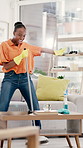 Happy, black woman and dancing with broom in home for fun cleaning, vibe or positive energy. Female person, housekeeping and cleaner singing with disinfection for hygiene, bacteria or dirt removal