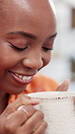 Happy, black woman and steam with coffee mug for comfort, morning beverage or warmth in home. Female person, relax and smelling cup with smile, heat or caffeine for aroma, scent or fragrance in house