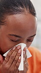 Woman, sneeze and blowing nose in house with tissue, health problem and flu symptoms from burnout. Sick, black person and allergy in home with toilet paper, virus and congestion from sinus infection.