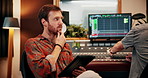 Artist, man and team in recording studio with tablet, thinking or search trends for song inspiration. Coworking, person and typing with tech for creativity, reflection or download app for music idea.