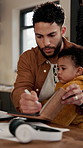 Man, writing and notebook with baby for remote work from home with review, multitasking and checklist. Person, dad and infant child with notes,  schedule and freelance writing job at family house