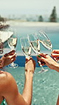 Hands, friends and champagne with toast at pool party with celebration, view and outdoor on holiday. Women, group and back with drinks, success and relax in summer with glasses at vacation resort