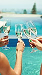 Hands, friends and celebration with toast at pool party with champagne, view and outdoor on holiday. Women, group and back with drinks, success and relax in summer with glasses at vacation resort