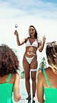 Champagne, toast and woman by pool for bridal shower, celebration and speech to friends. Travel, resort and person with drinks, beverage and alcohol for vacation, holiday and bachelorette party