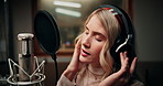 Microphone, musician and woman in studio with headphones for recording music with talent for album. Singing, artist and female person with audio tech for production on song with media in sound booth