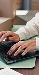 Woman, hands and laptop in office with ecommerce report, typing email or courier website for shipping. Person, browsing and computer in depot with delivery update, online logistics or administration.