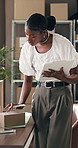 Box, clipboard and label with woman in logistics plant for management of shipping schedule. App, tracking and writing with employee person in supply chain office for delivery or distribution