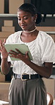 Boxes, supply chain and black woman in workplace, tablet for company website and smile. African person, entrepreneur or employee in office, stock inventory and tech for online order or ecommerce