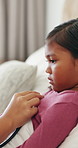 Stethoscope, hand and doctor with kid in bed for home consultation, chest pain or flu symptoms. Sick, medical tool and healthcare worker with girl patient for respiratory infection in bedroom.