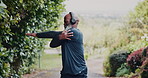 Stretching, outdoor and black man with fitness, exercise and headphones for radio, nature or workout. Runner, training or mature person with practice, warm up for health benefits or listen to podcast