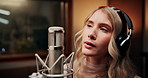 Microphone, singing and woman in studio with headphones for recording music with talent for album. Singer, artist and female musician with audio tech for production on song with media in sound booth